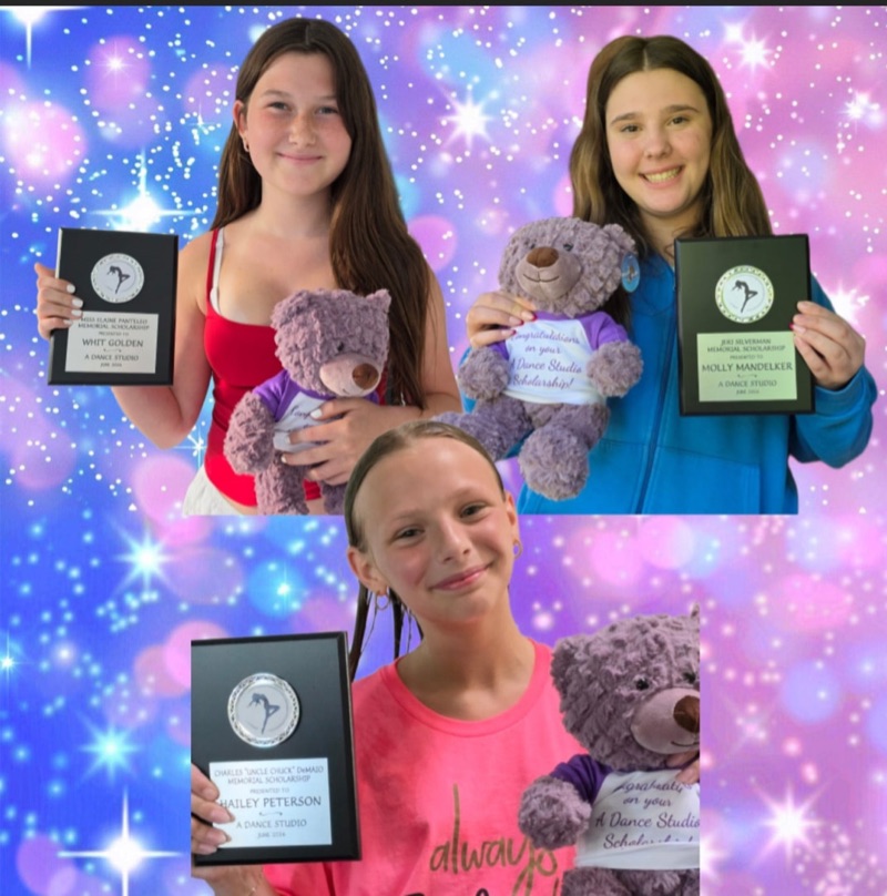 Our three scholarship winners holding their award plaques